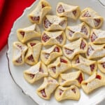platter of italian jam cookies with powdered sugar