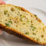 slice of homemade bread with olives in it