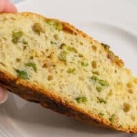 slice of homemade bread with olives in it
