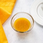 glass bowl of homemade orange vinaigrette