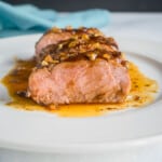 slice of pork tenderloin with garlic glaze