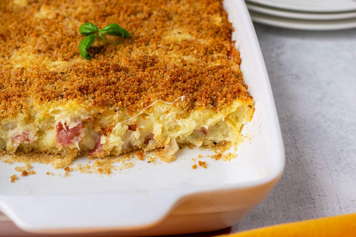 pan of gattò di patate (Italian potato casserole) with slices missing