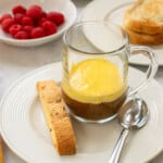clear mug of coffee topped with a layer of zabaglione (italian custard)