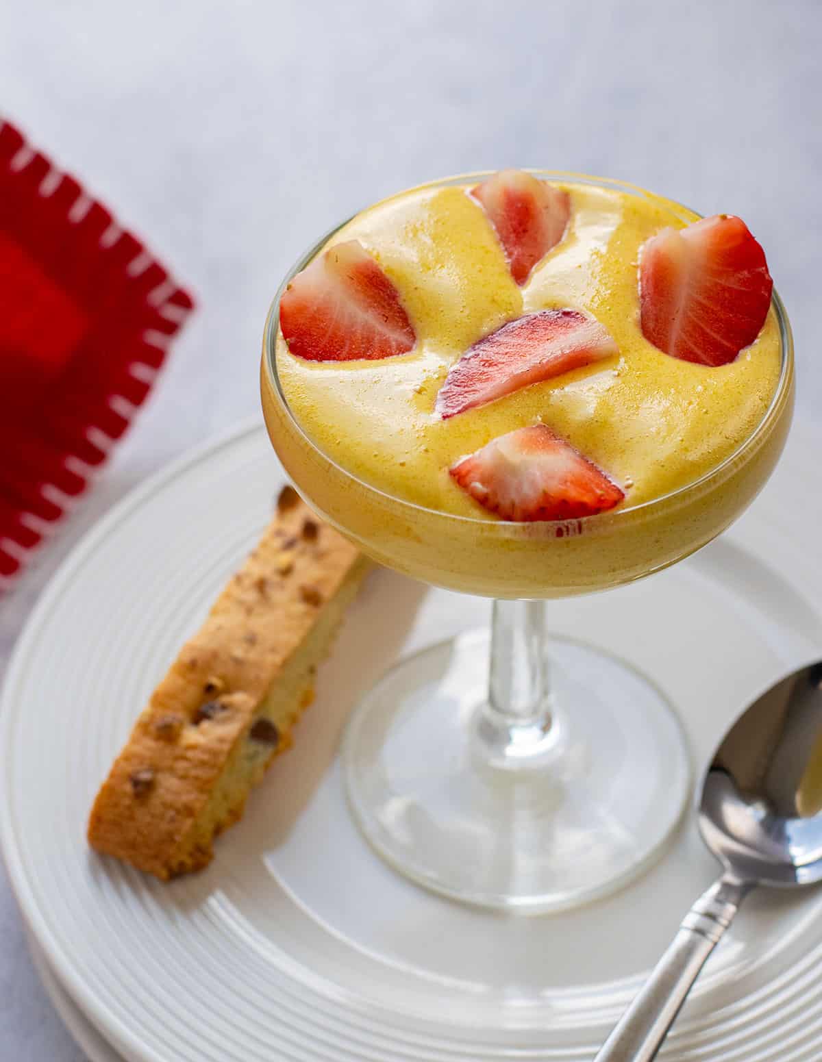 italian custard in glass with strawberries
