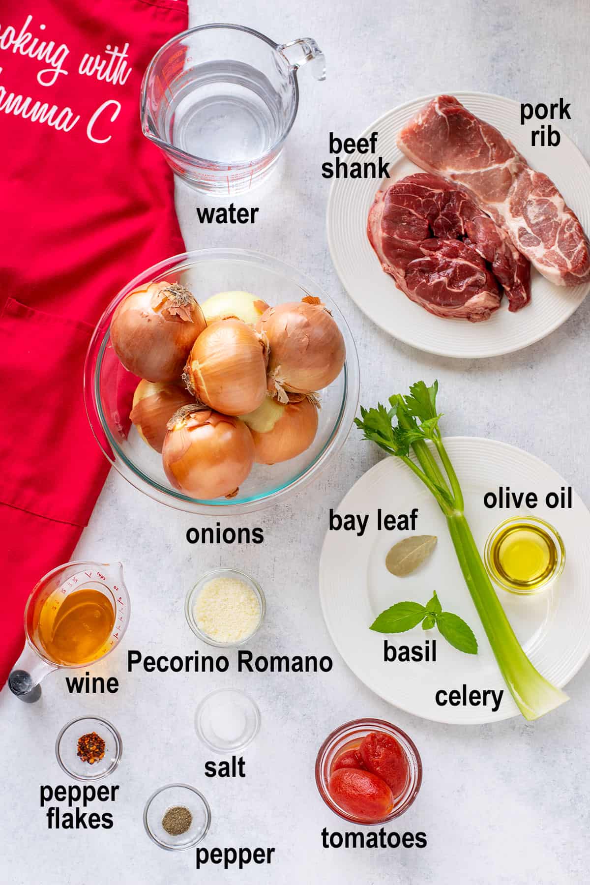 meat, water, onions, wine, celery, cheese, oil, tomatoes, spices